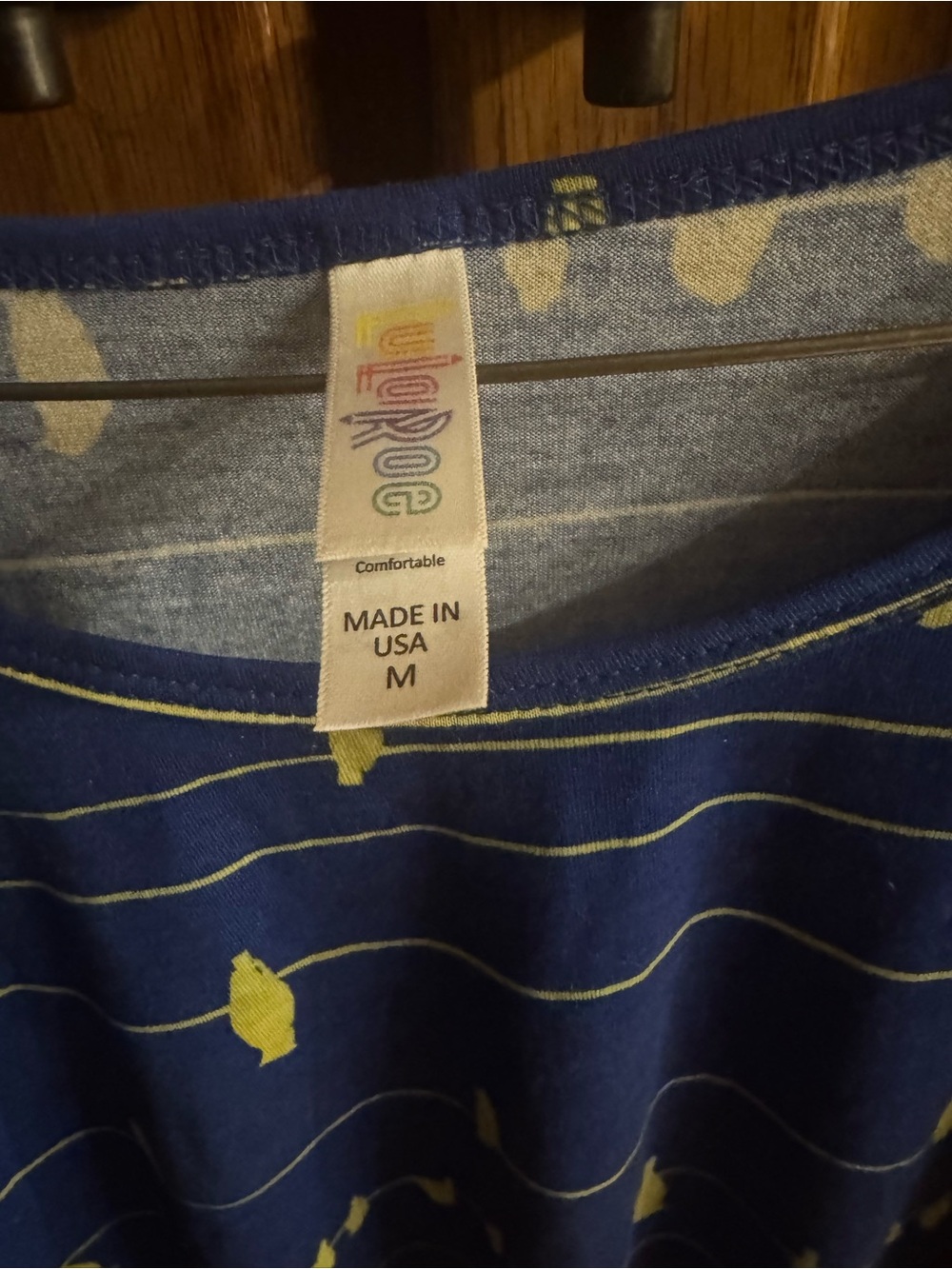 LuLaRoe Navy Blue Short Sleeve Top with Yellow Fish Stripe Print